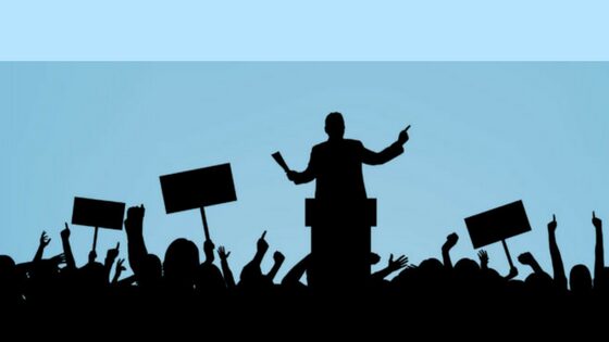 LInkedIn, Politics and your brand silhouette image of political rally. Used for post on mariedeveaux.com about online personal branding