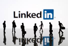 Image of people networking under the banner of the LInkedIN Lgo as accompanied by 5 tips on making LinkedIn work into your busy mompreneur schedule